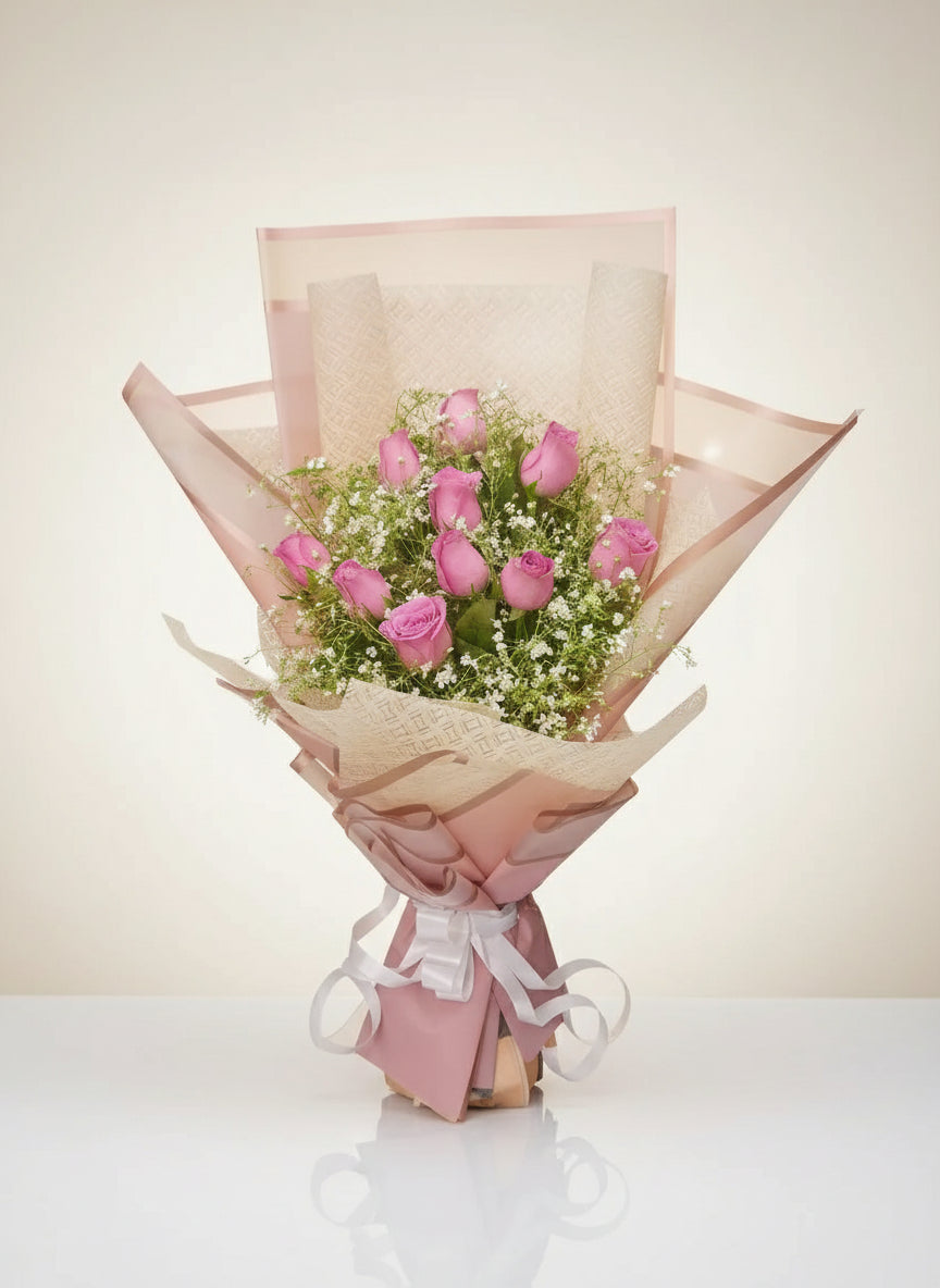 Elegant bouquet of pink roses with baby's breath – perfect for weddings, anniversaries, or gifts. Fresh, vibrant, and beautifully arranged.