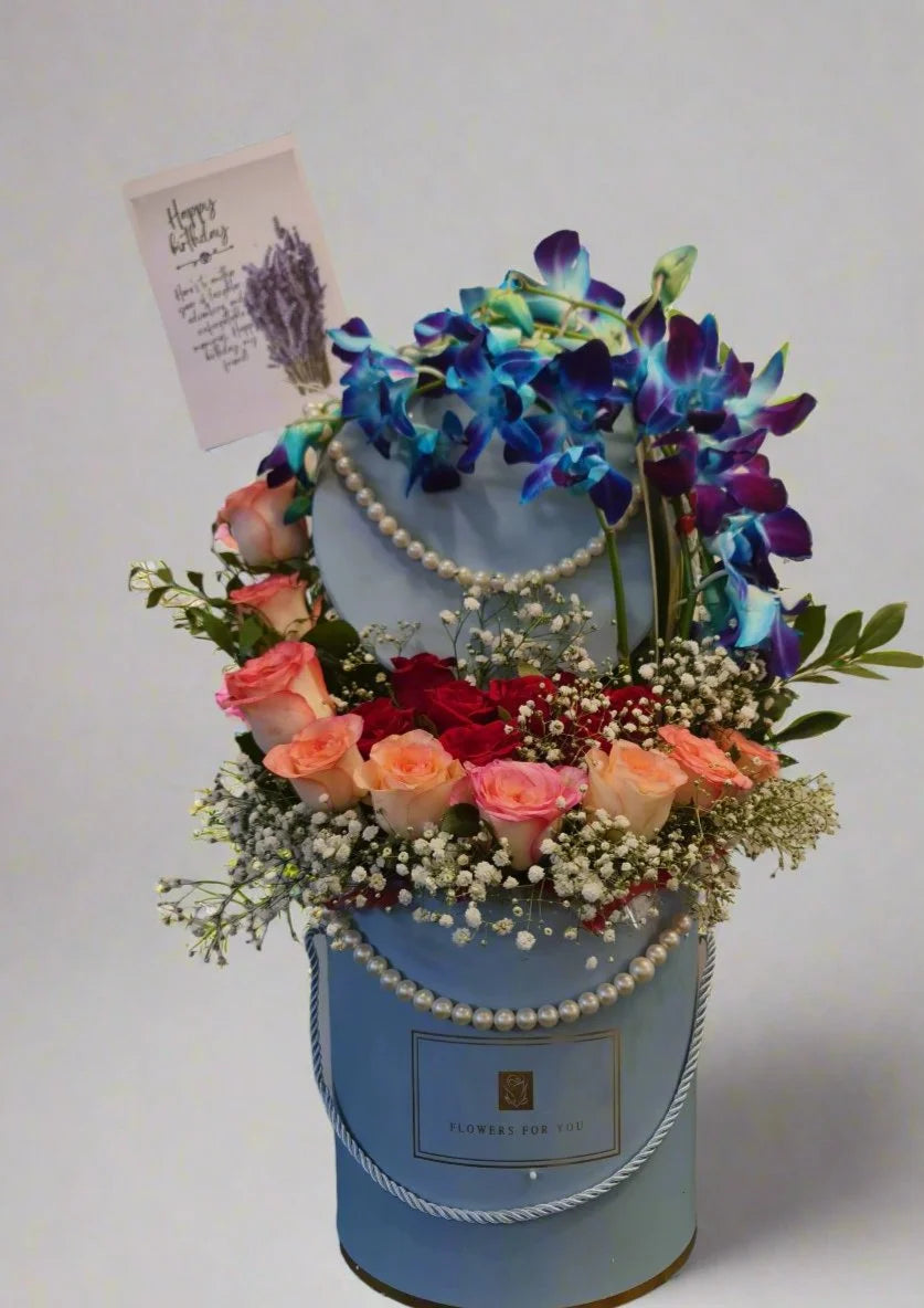 Elegant_Pink-Red_Roses_and_Orchid_Arrangement_d