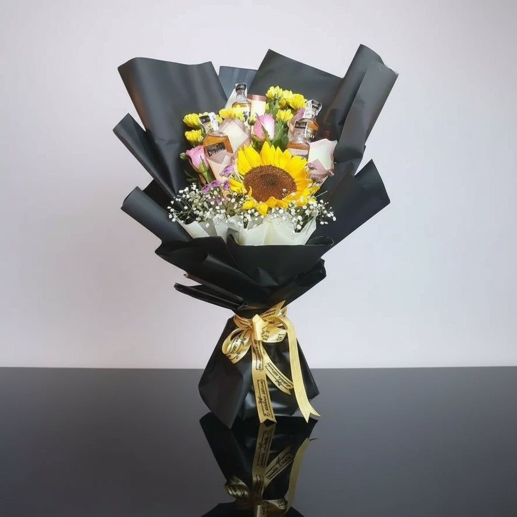 A beautiful bouquet of sunflower roses with pink roses in a sleek black wrapping. Perfect for any occasion, this vibrant and elegant floral arrangement combines joy and romance.