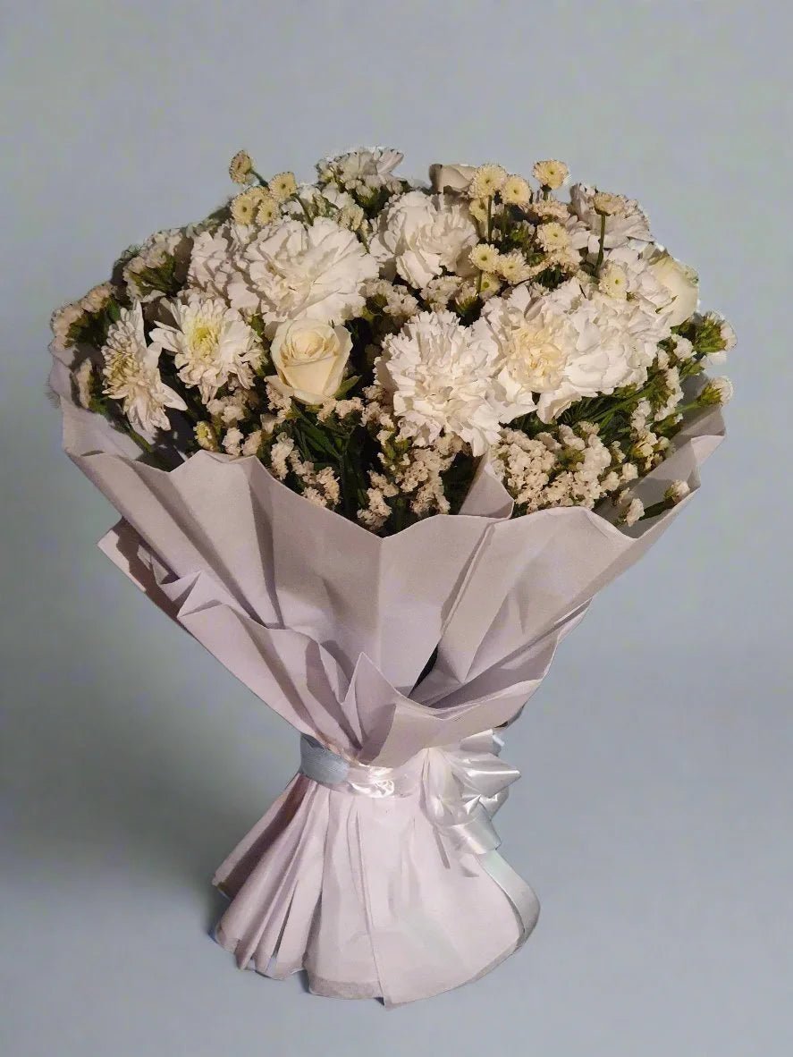A stunning bouquet of pink, yellow, and white roses, perfect for any celebration or heartfelt gift, with a harmonious touch of elegance and warmth.