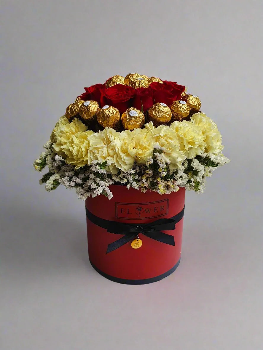 Make every celebration unforgettable with a stunning arrangement of red roses and delicious Ferrero Rocher chocolates.