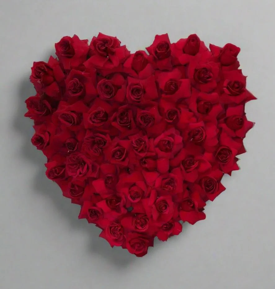 Shop a stunning heart-shaped floral arrangement with vibrant red roses, perfect for expressing love and affection. Order now for a memorable gift.