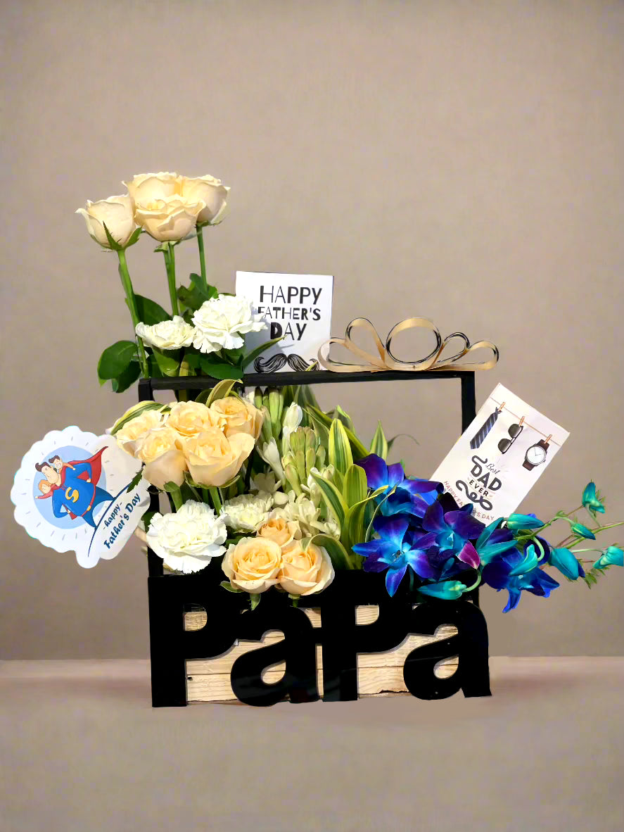 Brighten any occasion with vibrant yellow roses and serene purple-blue lilies. A perfect gift of joy, beauty, and sophistication.